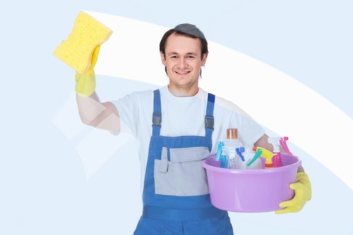 Front view of a professional cleaner preparing supplies